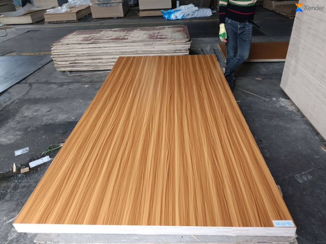 Large teak-finish plywood panel on the warehouse floor at Anason Wood Ltd